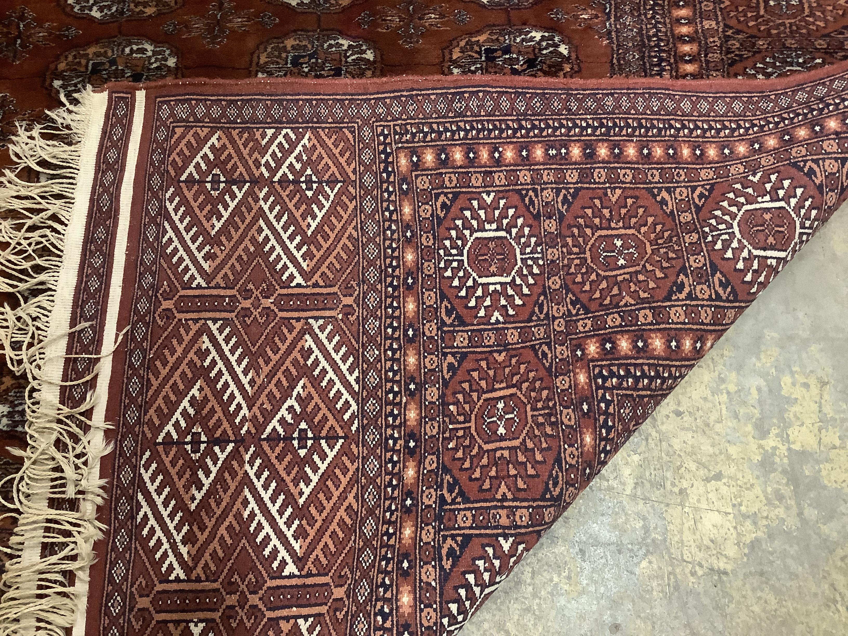 A Bokhara red ground carpet, 310 x 237cm